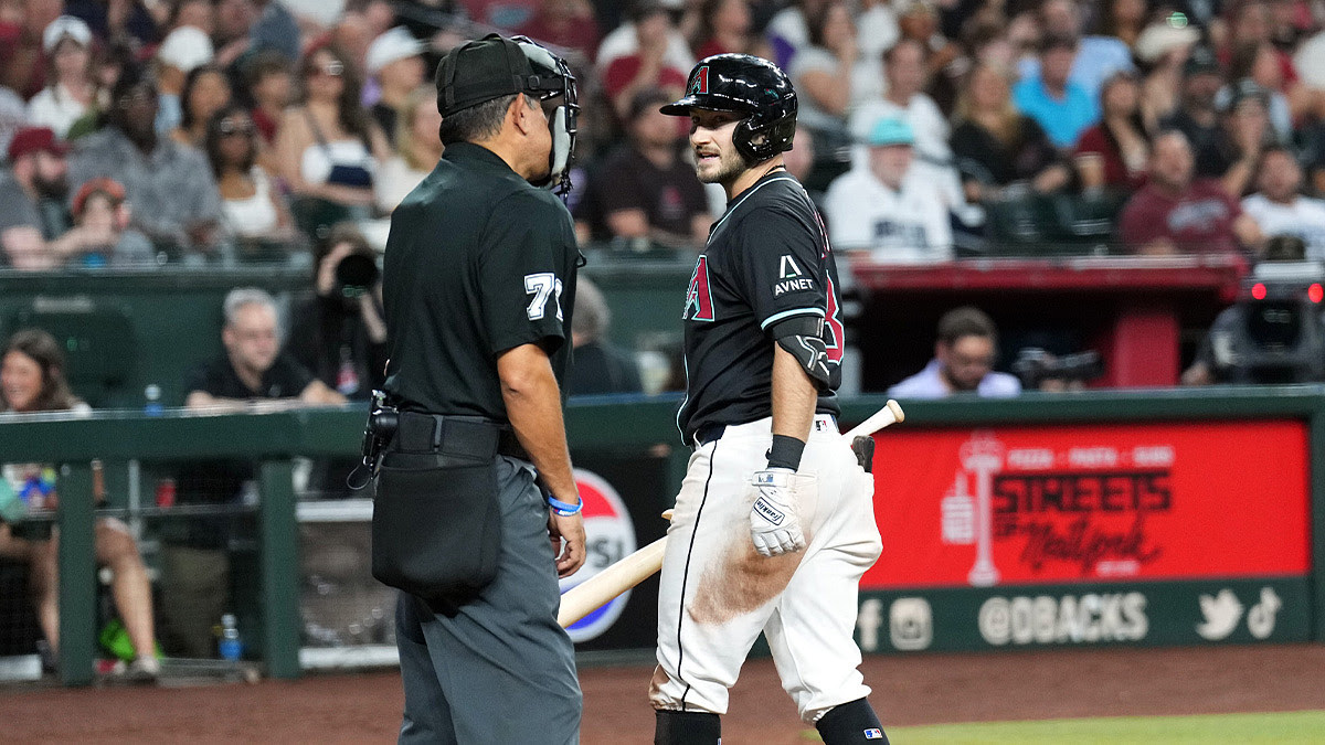 Arizona Diamondbacks outfielder Garrett Hampson (8) argues a strikeout call with home plate umpire Alfonso Marquez (72) during the fifth inning against the Milwaukee Brewers at Chase Field.