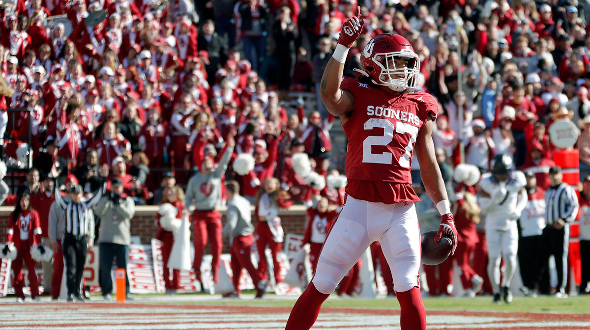 Oklahoma Sooners running back Gavin Sawchuk (27) celebrates after a touchdown during a college football game between the University of Oklahoma Sooners (OU) and the TCU Horned Frogs at Gaylord Family-Oklahoma Memorial Stadium in Norman, Okla., Friday, Nov. 24, 2023. Oklahoma won 69-45.
