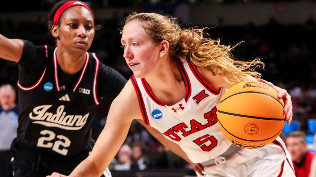 Utah Utes guard Gianna Kneepkens drives past Indiana Hoosiers guard Chloe Moore-McNeil in the second half at Colonial Life Arena.