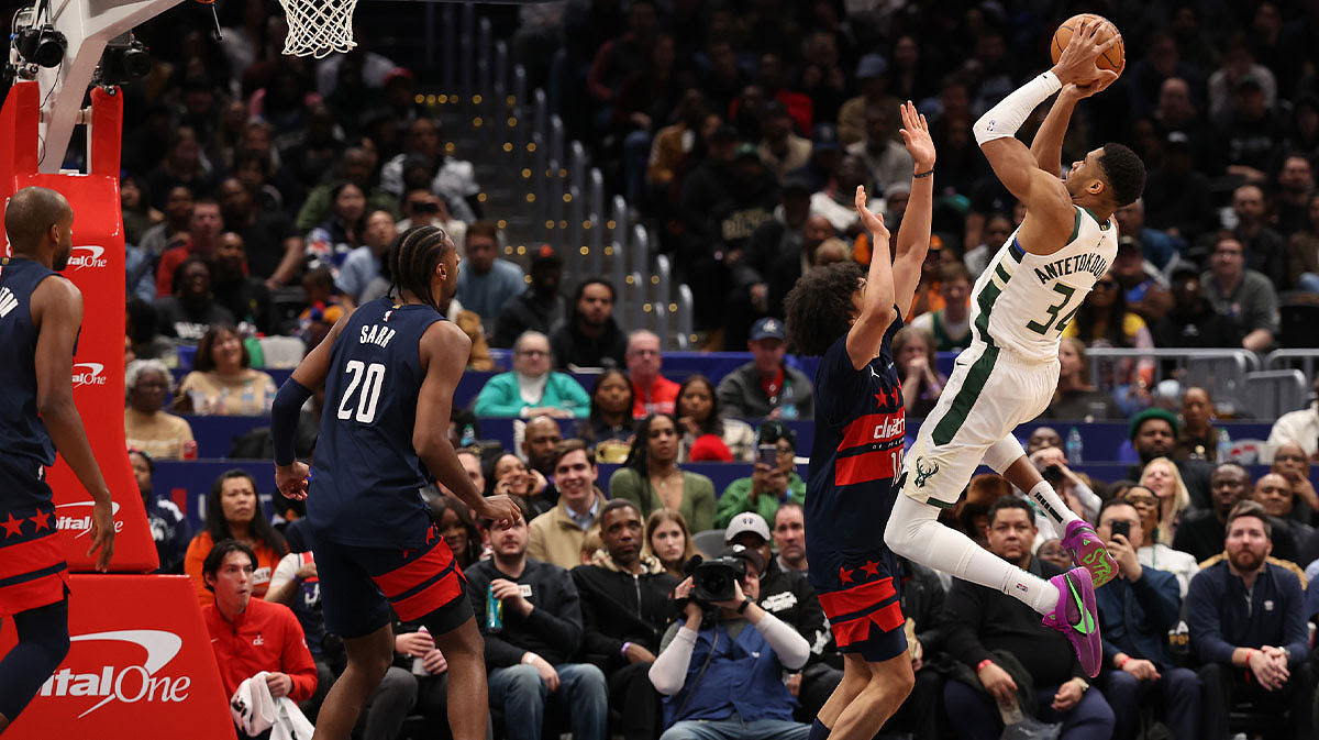 Milwaukee Bucks forward Giannis Antetokounmpo (34) shoots the ball over Washington Wizards forward Kyshawn George (18) in the second half.
