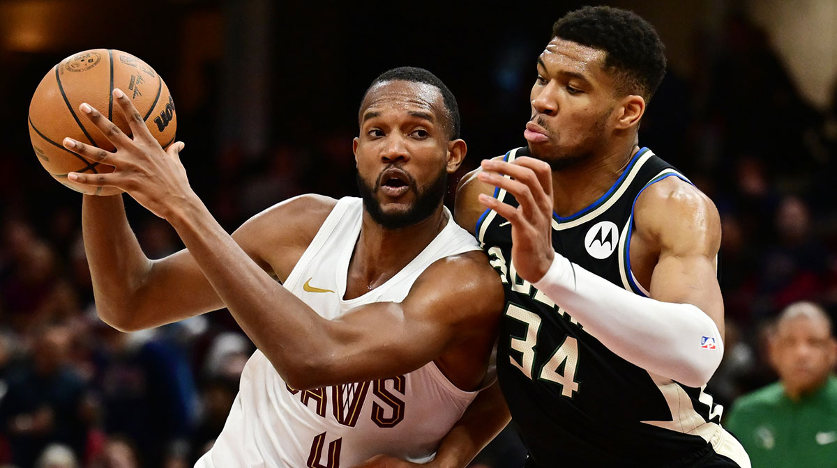 Cleveland Cavaliers forward Evan Mobley (4) drives to the basket against Milwaukee Bucks forward Giannis Antetokounmpo (34) during the second half at Rocket Mortgage FieldHouse.