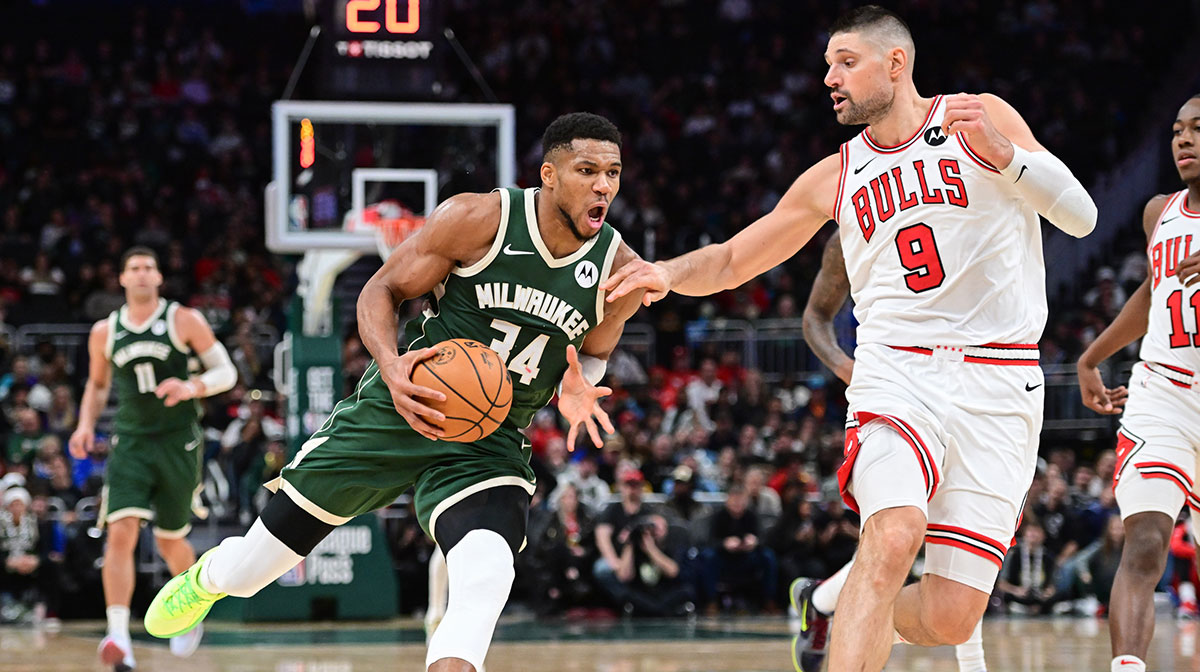 Milwaukee Bucks forward Giannis Antetokounmpo (34) drives for the basket against Chicago Bulls center Nikola Vucevic (9) in the fourth quarter at Fiserv Forum.