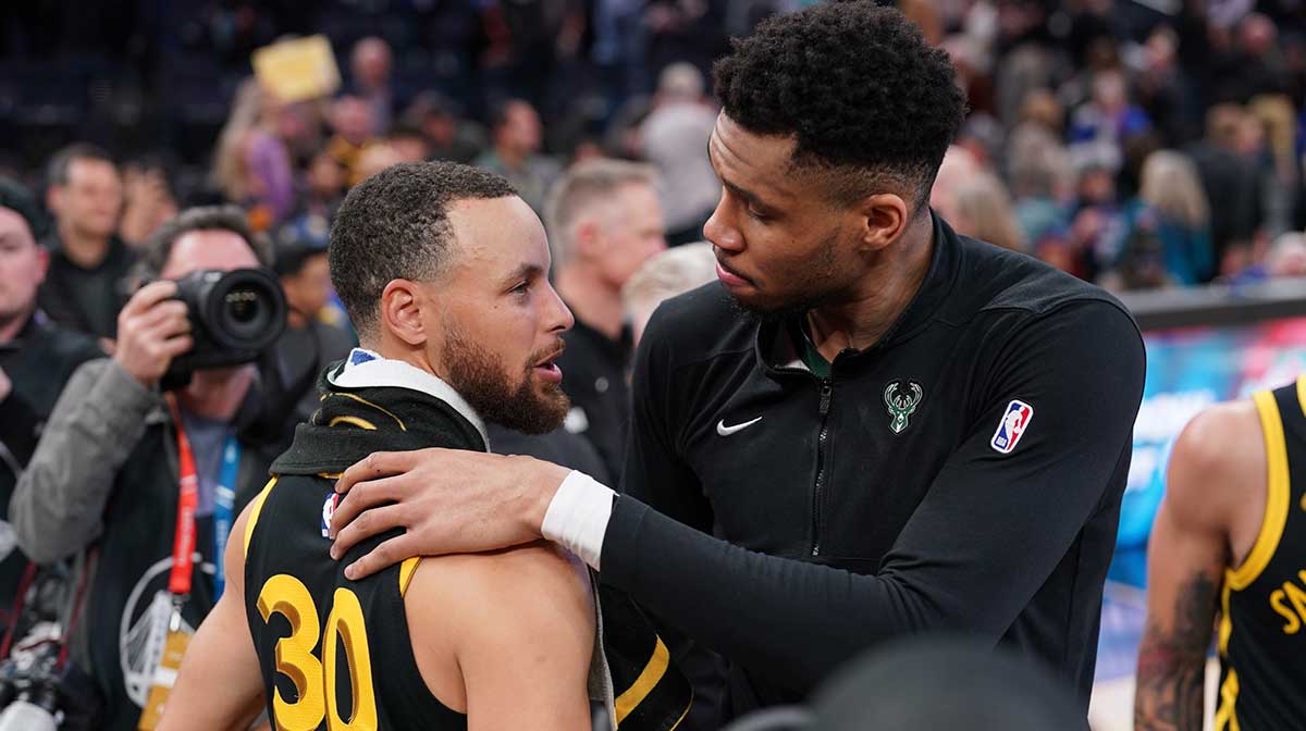 Milwaukee Bucks forward Giannis Antetokounmpo (34) and Golden State Warriors guard Stephen Curry (30) meet after the game at the Chase Center.