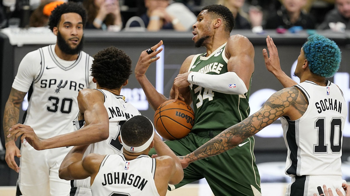 Milwaukee Bucks forward Giannis Antetokounmpo (34) loses the ball while driving to the basket against San Antonio Spurs center Victor Wembanyama (1) and forward Jeremy Sochan (10) during the second half at Frost Bank Center.