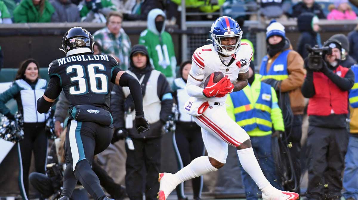 New York Giants wide receiver Malik Nabers (1) catches pass for a 45-yard touchdown against Philadelphia Eagles safety Tristin McCollum (36) during the fourth quarter at Lincoln Financial Field.