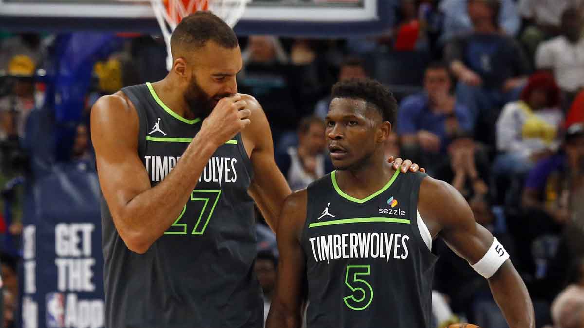 Minnesota Timberwolves center Rudy Gobert (27) talks with guard Anthony Edwards (5) during a time out during the fourth quarter against the Memphis Grizzlies at FedExForum.