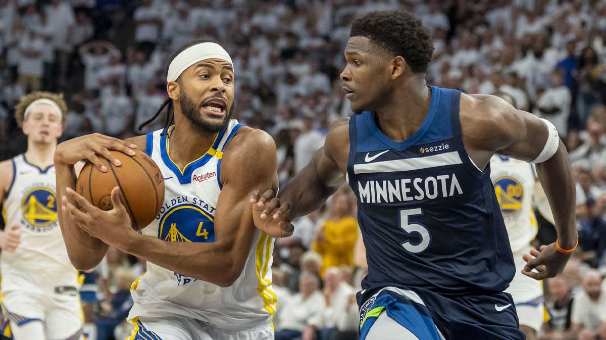 Golden State Warriors guard Moses Moody (4) drives to the basket past Minnesota Timberwolves guard Anthony Edwards (5) in the second half during game five of the second round for the 2025 NBA Playoffs at Target Center.