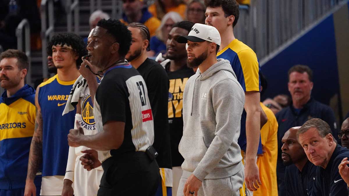 Golden State Warriors guard Stephen Curry (30) watches injured from the sideline in the second quarter against the Minnesota Timberwolves during game three in the second round of the 2025 NBA Playoffs at Chase Center.