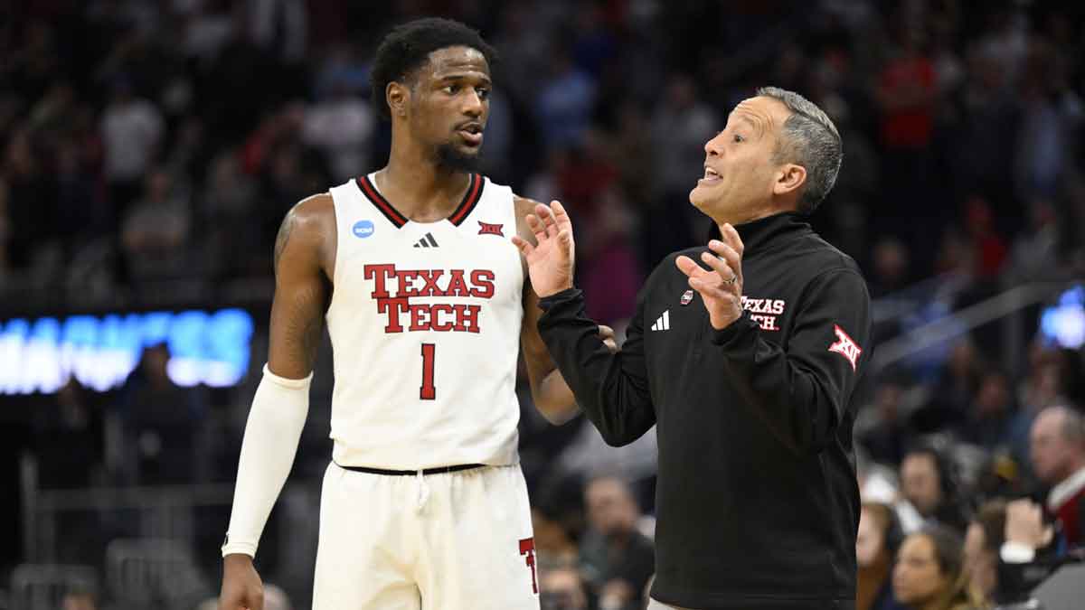 Texas Tech Red Raiders guard Kevin Overton (1) talks to head coach Grant McCasland during overtime against the Arkansas Razorbacks during a West Regional semifinal of the 2025 NCAA tournament at Chase Center.