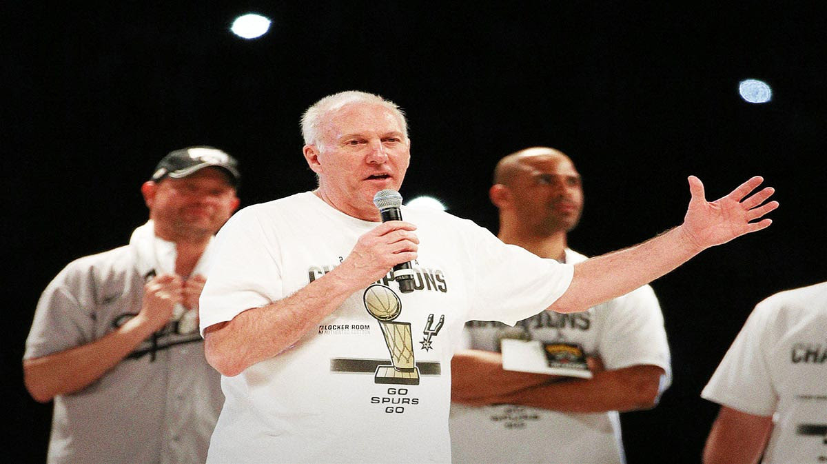 San Antonio Spurs head coach Gregg Popovich speaks to the crowd during NBA championship celebration.
