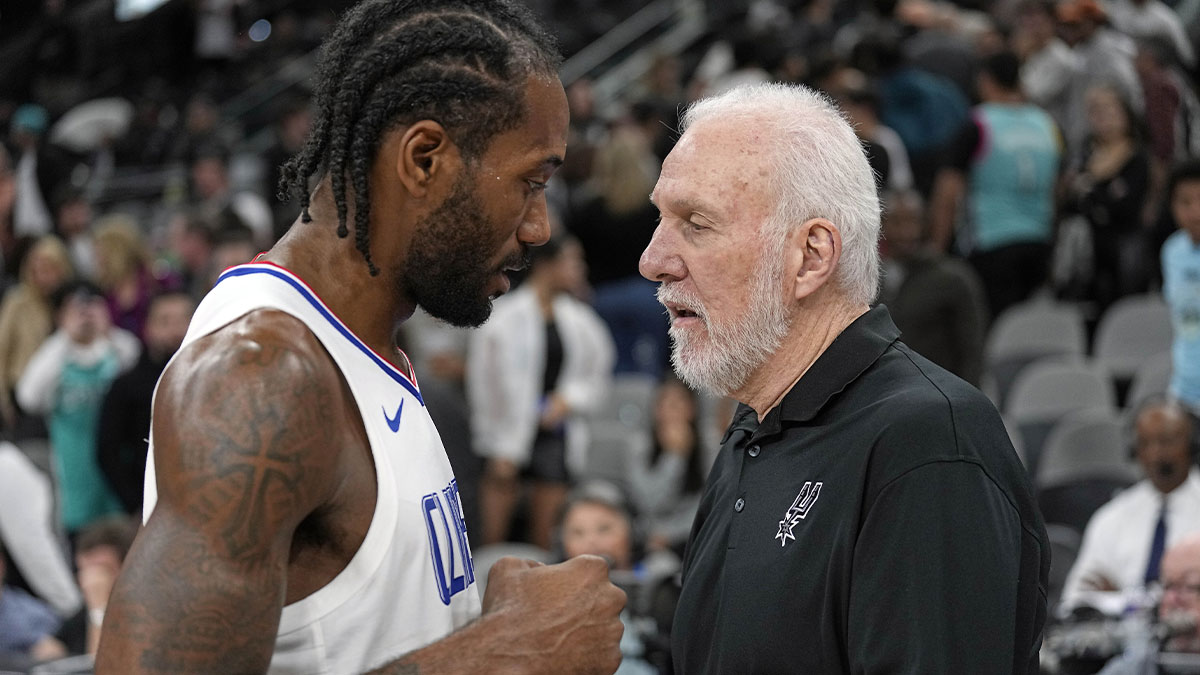 San Antonio Spurs head coach Gregg Popovich talks with Los Angeles Clippers forward Kawhi Leonard (2) after a game at Frost Bank Center.