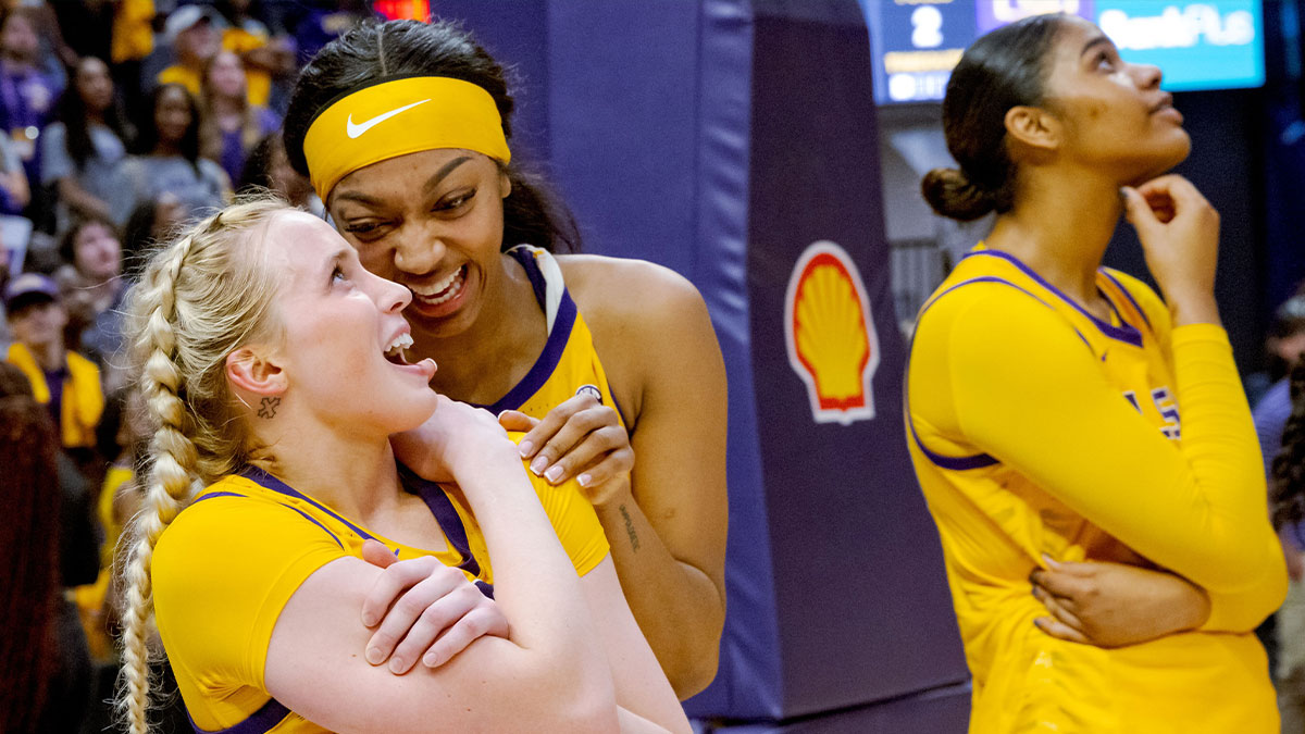 Sky guard Hailey Van Lith, left, and forward Angel Reese react to a senior tribute video for them after their victory against the Kentucky Wildcats at Pete Maravich Assembly Center.