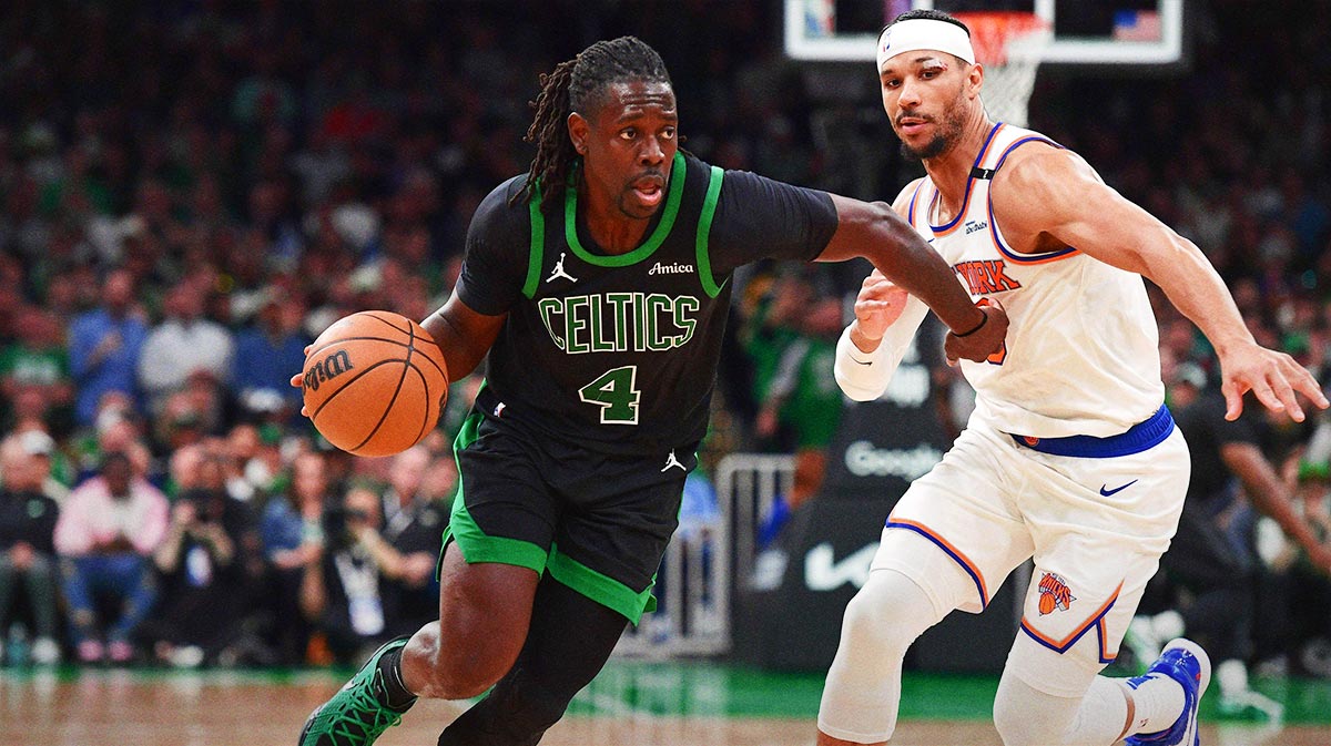 Boston Celtics guard Jrue Holiday (4) controls the ball while New York Knicks guard Josh Hart (3) defends in the second half during game five of the second round for the 2025 NBA Playoffs at TD Garden.