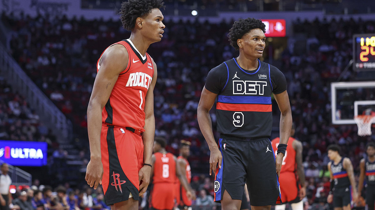 Houston Rockets forward Amen Thompson (1) and Detroit Pistons forward Ausar Thompson (9) on the court during the game at Toyota Center.
