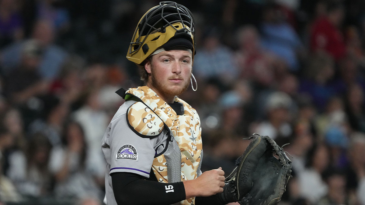Colorado Rockies catcher Hunter Goodman (15) looks for a replay sign against the Arizona Diamondbacks in the first inning at Chase Field.