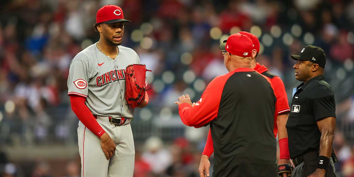 Cincinnati Reds starting pitcher Hunter Greene (21) leaves the game with an injury against the Atlanta Braves in the fourth inning at Truist Park.