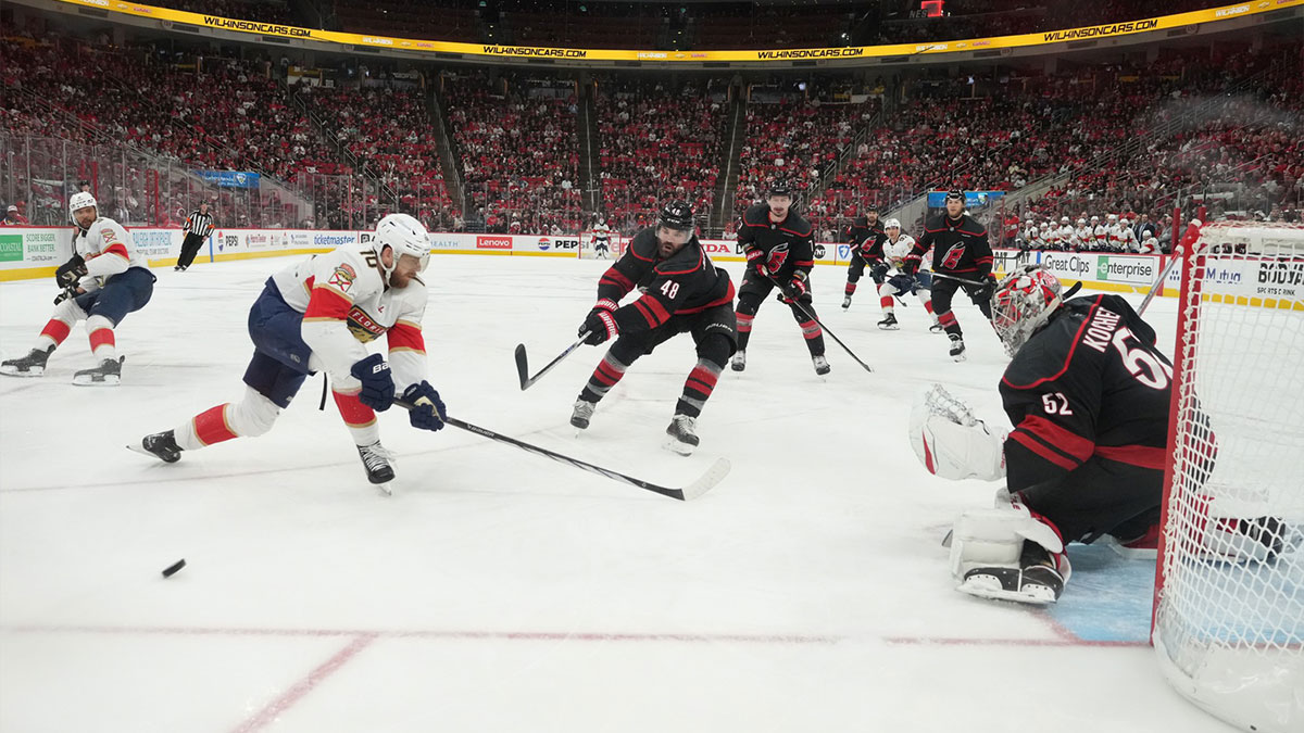 Carolina Hurricanes goaltender Pyotr Kochetkov (52) and forward Jordan Martinook (48) defend against Florida Panthers forward A.J. Greer (10) during the second period in game two of the Eastern Conference Final of the 2025 Stanley Cup Playoffs at Lenovo Center.