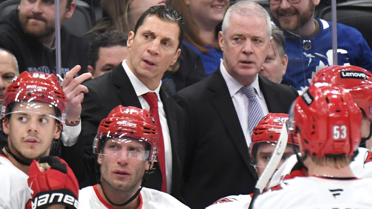 Carolina Hurricanes head coach Rod Brind'Amour gestures as he speaks to his players and assistant coach Jeff Daniels in the third period against the Toronto Maple Leafs at Scotiabank Arena.