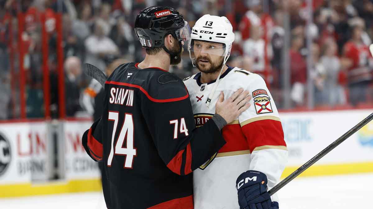 Carolina Hurricanes defenseman Jaccob Slavin (74) congratulates Florida Panthers forward Sam Reinhart (13) after the loss in the third period in game five of the Eastern Conference Final of the 2025 Stanley Cup Playoffs at Lenovo Center.