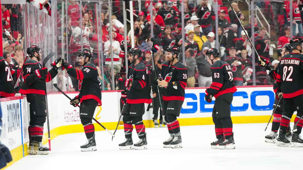 Carolina Hurricanes players celebrate their victory against the Washington Capitals in game four of the second round of the 2025 Stanley Cup Playoffs at Lenovo Center.
