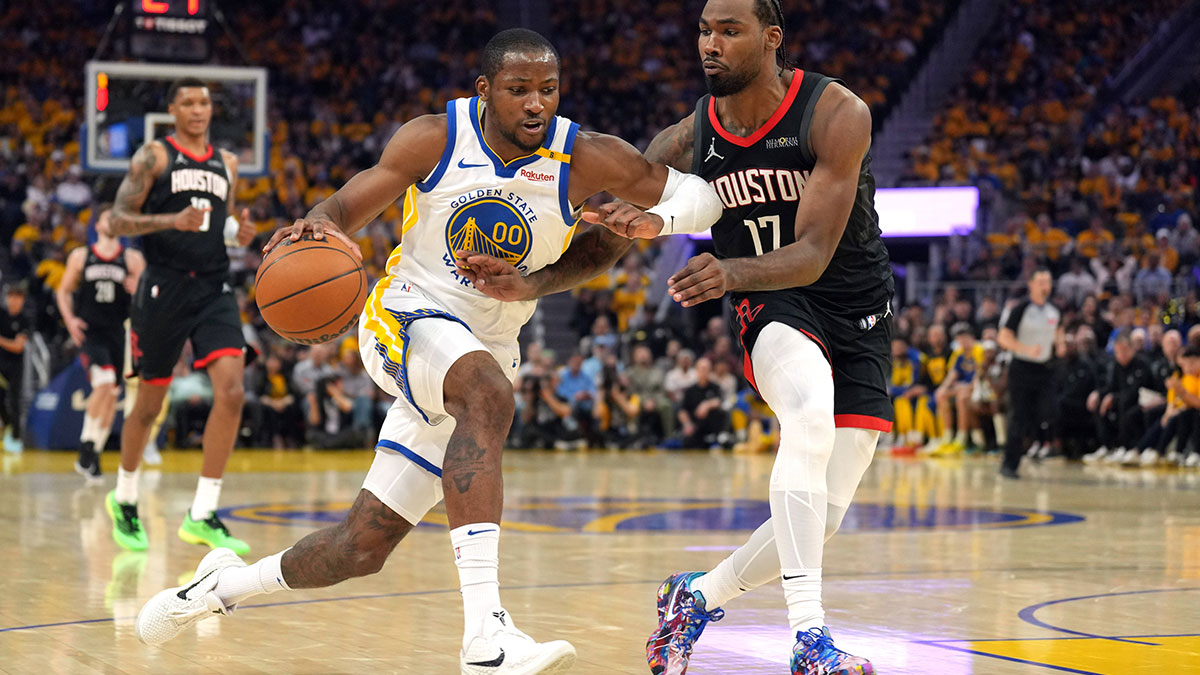Golden State Warriors forward Jonathan Kuminga (00) dribbles against Houston Rockets forward Tari Eason (17) during the second quarter of game three of first round for the 2024 NBA Playoffs at Chase Center.