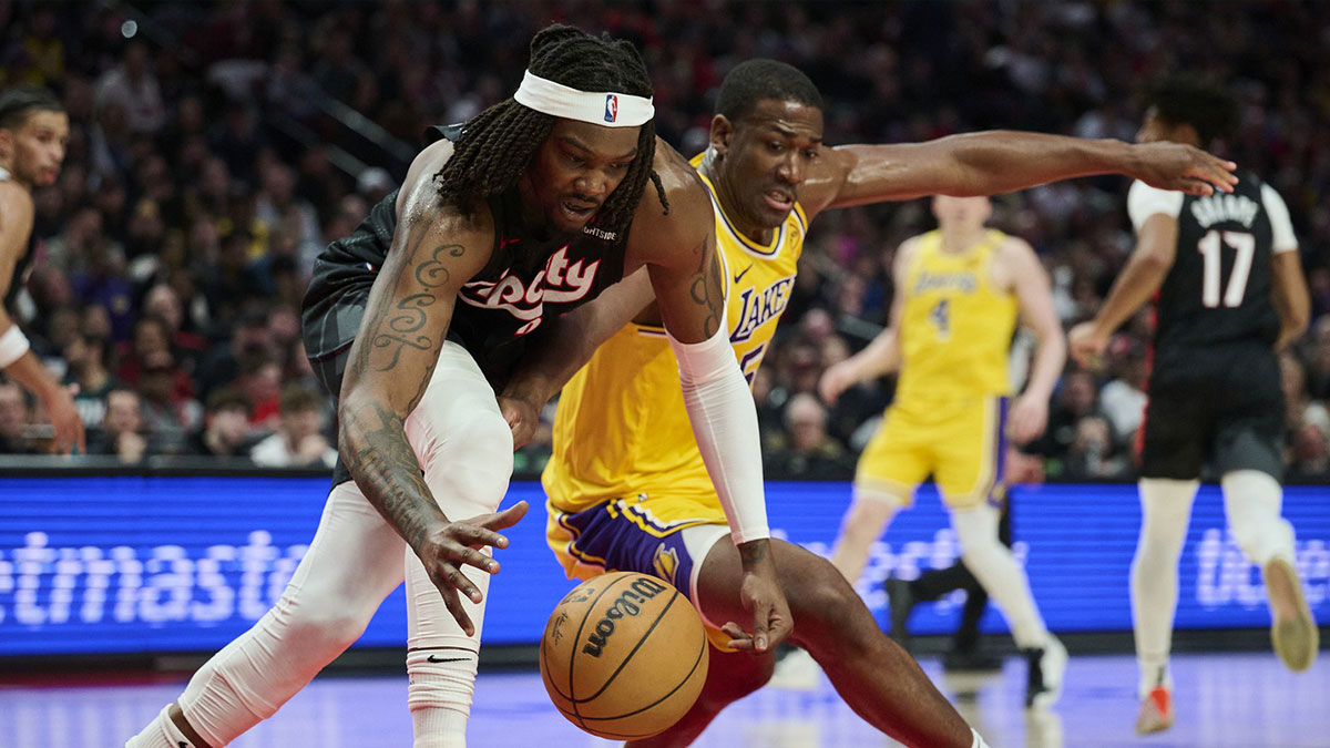 Portland Trail Blazers center Robert Williams III (35) and Los Angeles Lakers center Trey Jemison III (55) battle for control of a lose ball during the second half at Moda Center.