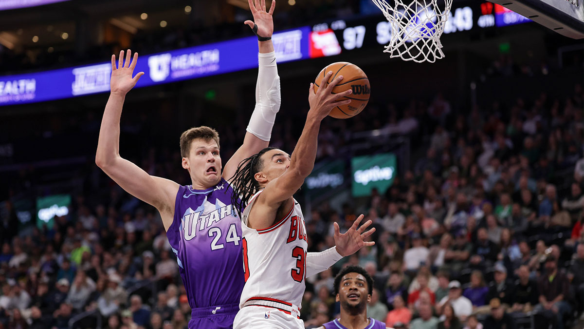Chicago Bulls guard Tre Jones (30) gets past Utah Jazz center Walker Kessler (24) and to the basket during the second half at Delta Center.