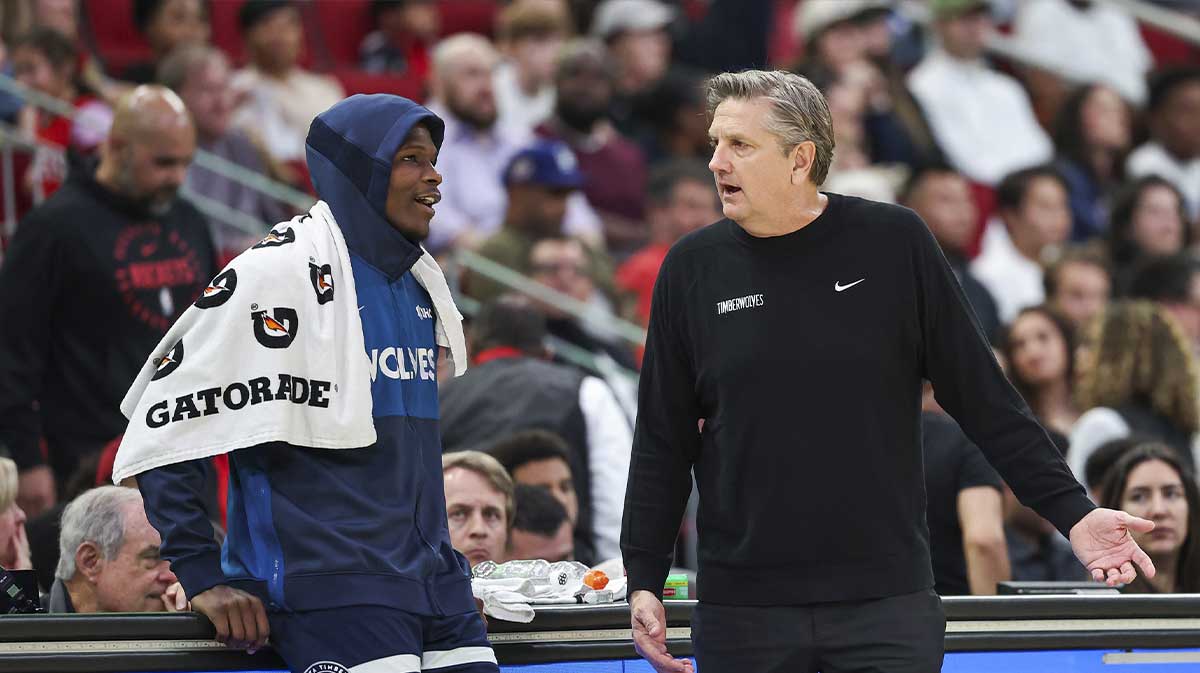 Minnesota Timberwolves head coach Chris Finch talks with guard Anthony Edwards (5) during the fourth quarter against the Houston Rockets at Toyota Center.
