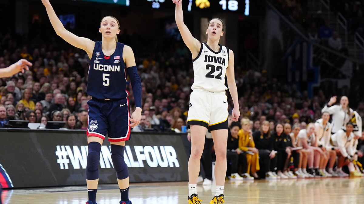 Iowa Hawkeyes guard Caitlin Clark (22) and Connecticut Huskies guard Paige Bueckers (5) react in the second quarter in the semifinals of the Final Four of the womens 2024 NCAA Tournament at Rocket Mortgage FieldHouse.