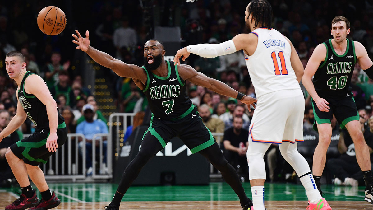 ; New York Knicks guard Jalen Brunson (11) passes the ball past Boston Celtics guard Jaylen Brown (7) in the second half during game five of the second round for the 2025 NBA Playoffs at TD Garden.
