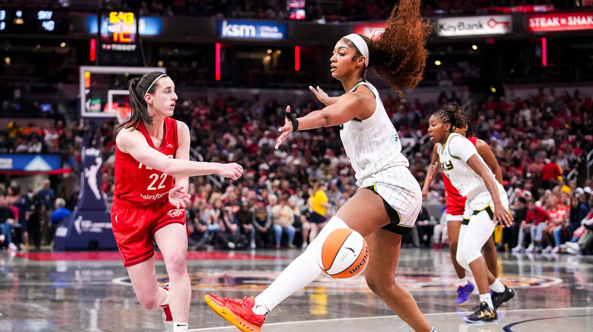 Indiana Fever guard Caitlin Clark (22) passes around Chicago Sky forward Angel Reese (5) on Saturday, May 17, 2025, during a game between the Indiana Fever and the Chicago Sky at Gainbridge Fieldhouse in Indianapolis. The Indiana Fever defeated the Chicago Sky, 93-58.