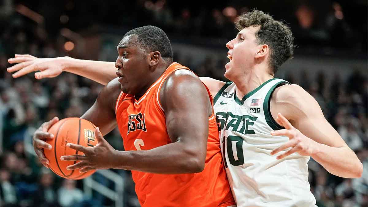 Bowling Green forward Marcus Johnson (6) grabs a rebound against Michigan State center Szymon Zapala (10) during the first half at Breslin Center in East Lansing on Saturday, Nov. 16, 2024.