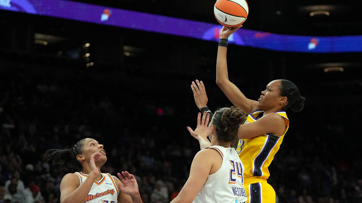 Los Angeles Sparks forward Azura Stevens (23) shoots over Phoenix Mercury forward Kathryn Westbeld (24) and forward Alyssa Thomas (25) in the first half at Footprint Center.