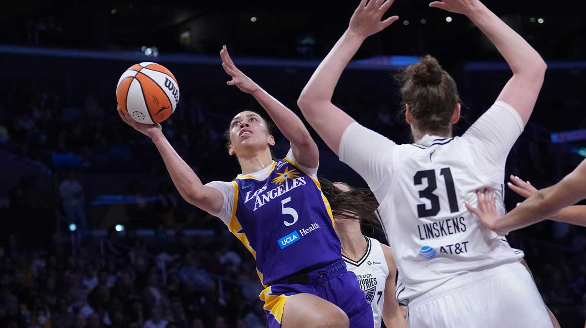 LA Sparks forward Dearica Hamby (5) shoots the ball against Golden State Valkyries center Kyara Linskens (31) in the first half at Crypto.com Arena.