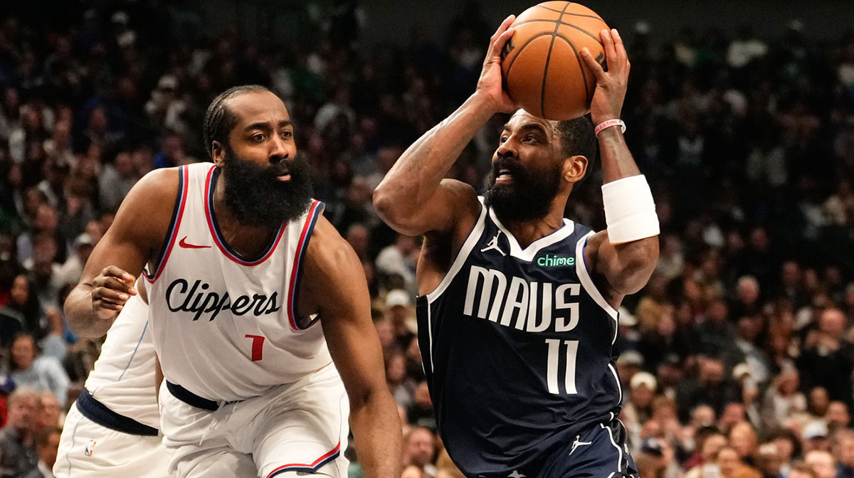 Dallas Mavericks guard Kyrie Irving (11) drives to the basket as LA Clippers guard James Harden (1) defends during the second half at American Airlines Center.