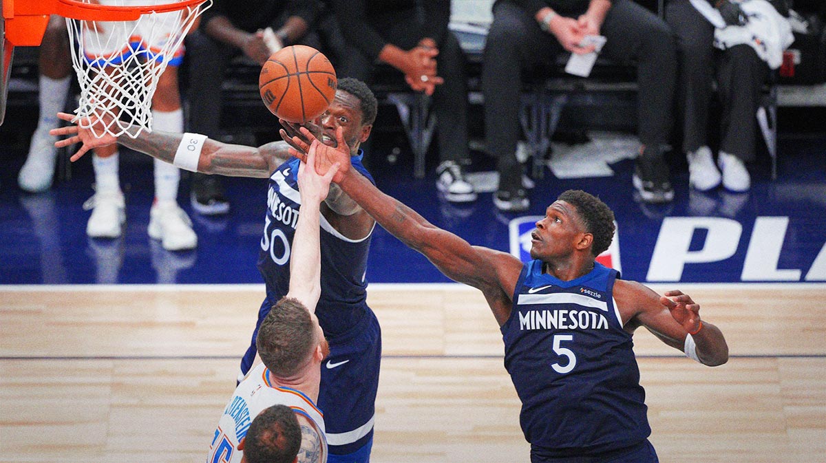 Minnesota Timberwolves forward Julius Randle (30),guard Anthony Edwards (5) and Oklahoma City Thunder center Isaiah Hartenstein (55) attempt to get a rebound during the second half in game three of the western conference finals for the 2025 NBA Playoffs at Target Center.