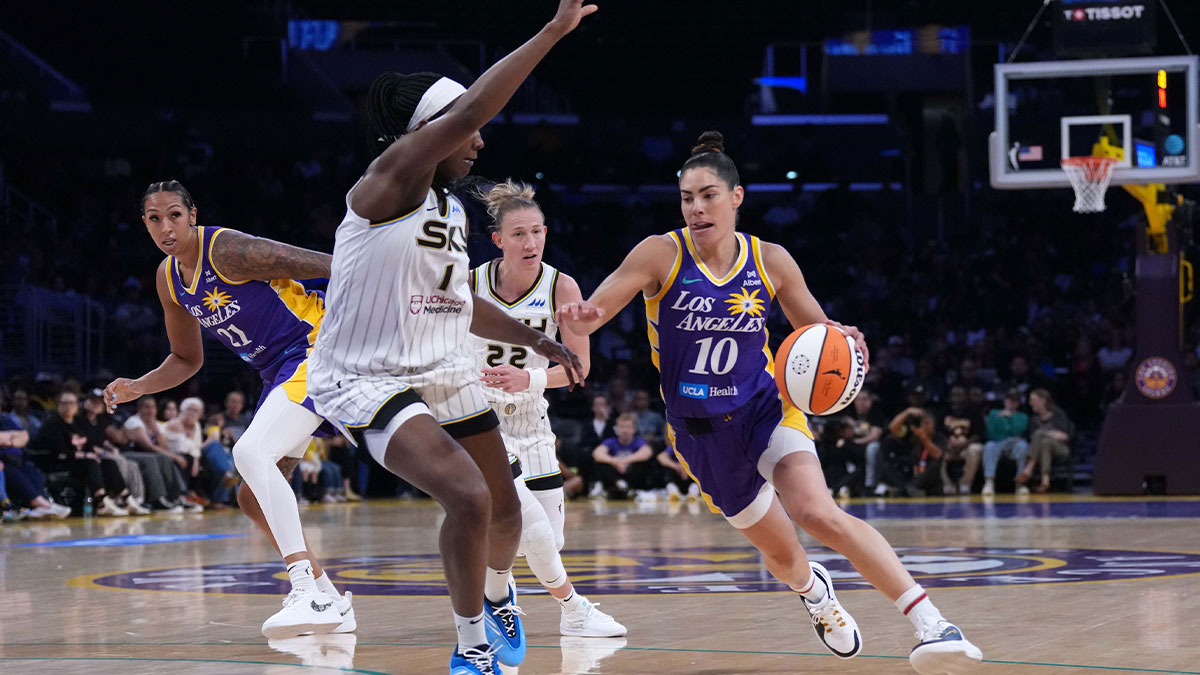 LA Sparks guard Kelsey Plum (10) dribbles the ball against Chicago Sky center Elizabeth Williams (1) in the first half at Crypto.com Arena.