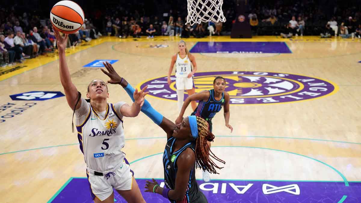 LA Sparks forward Dearica Hamby (5) shoots against Atlanta Dream guard Rhyne Howard (10) in the first half at Crypto.com Arena.