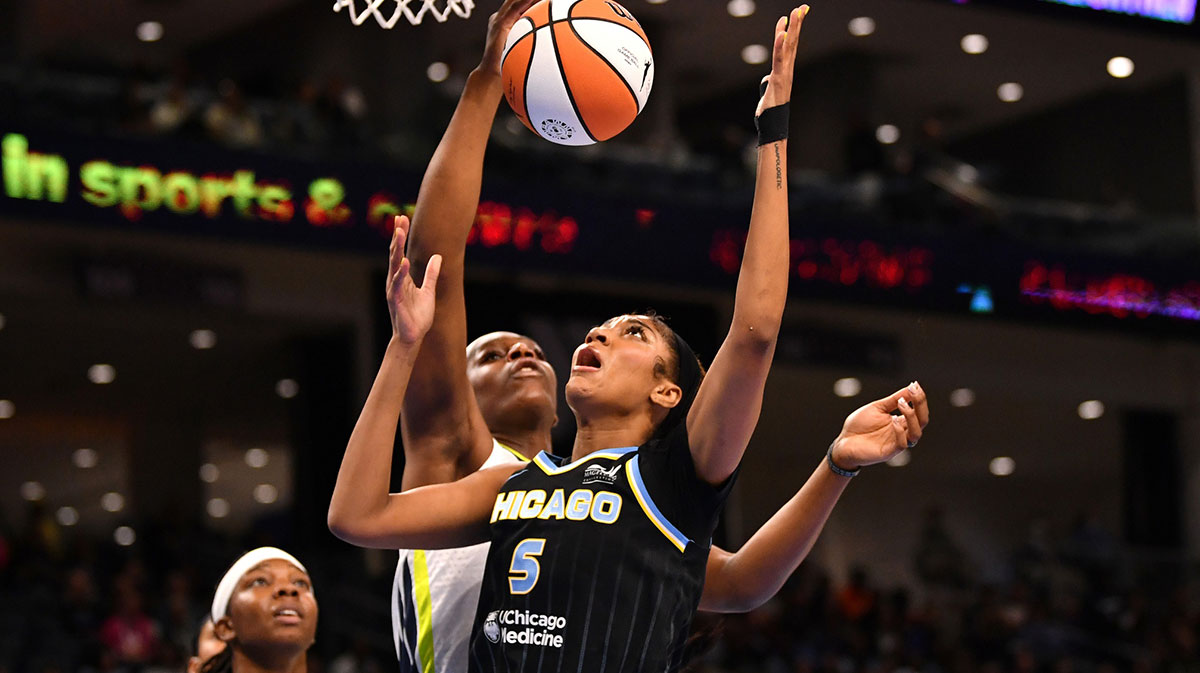 Chicago Sky forward Angel Reese (5) and Dallas Wings center Teaira McCowan (15) go up for the ball during the first half at the Wintrust Arena.