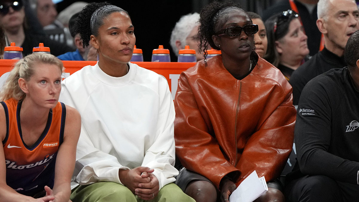 Phoenix Mercury forward Alyssa Thomas (25) and guard Kahleah Copper (2) watch game action against the Minnesota Lynx in the first half at Footprint Center.