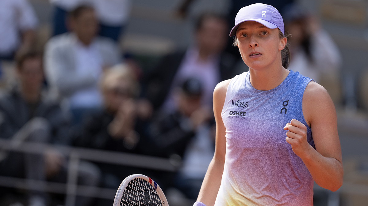 Iga Swiatek of Poland celebrates winning her match against Emma Raducanu of Great Britain on day four at Roland Garros Stadium.