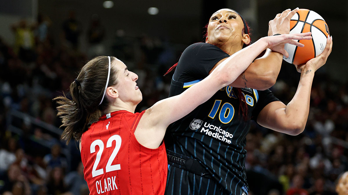 Aug 30, 2024; Chicago, Illinois, USA; Indiana Fever guard Caitlin Clark (22) fouls Chicago Sky center Kamilla Cardoso (10) during the second half at Wintrust Arena. Mandatory Credit: Kamil Krzaczynski-Imagn Images