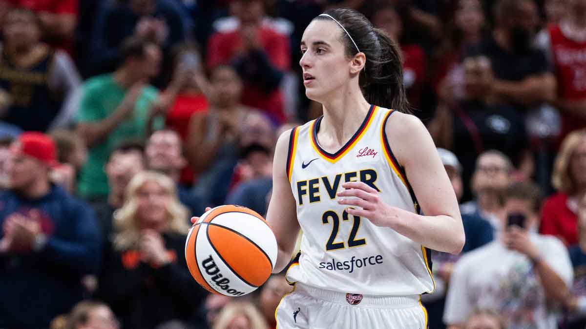 Indiana Fever guard Caitlin Clark (22) dribbles the ball in the second half against the New York Liberty at Gainbridge Fieldhouse.