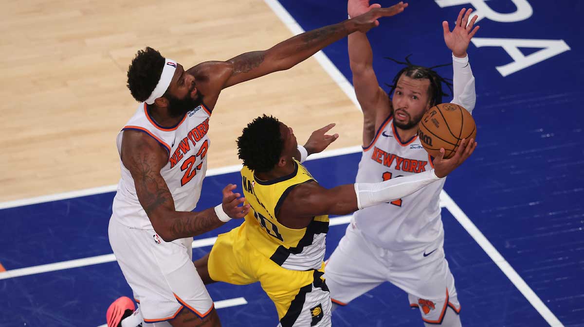 Indiana Pacers guard Bennedict Mathurin (00) shoots against New York Knicks center Mitchell Robinson (23) and guard Jalen Brunson (11) in the third quarter during game five of the eastern conference finals for the 2025 NBA Playoffs at Madison Square Garden.