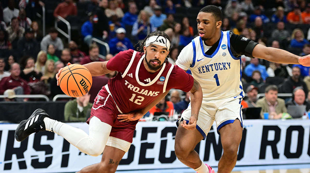 Troy Trojans guard Tayton Conerway (12), now of Indiana basketball, drives to the hoop past Kentucky Wildcats guard Lamont Butler (1) during the second half at Fiserv Forum.