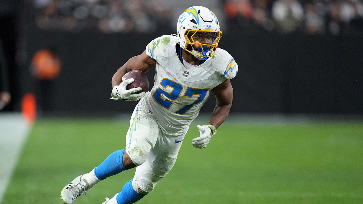 Los Angeles Chargers running back J.K. Dobbins (27) carries the ball against the Las Vegas Raiders in the second half at Allegiant Stadium.
