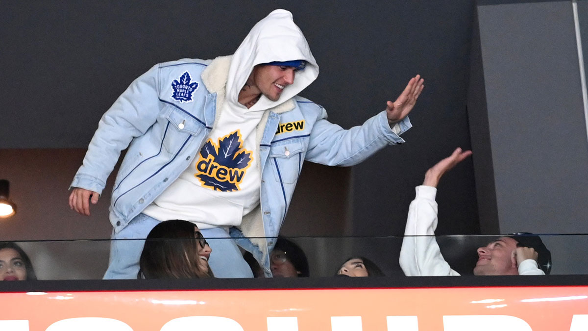 Canadian singer Justin Bieber celebrates after the Toronto Maple Leafs scored a goal against the Los Angeles Kings in the second period of the game at Staples Center.