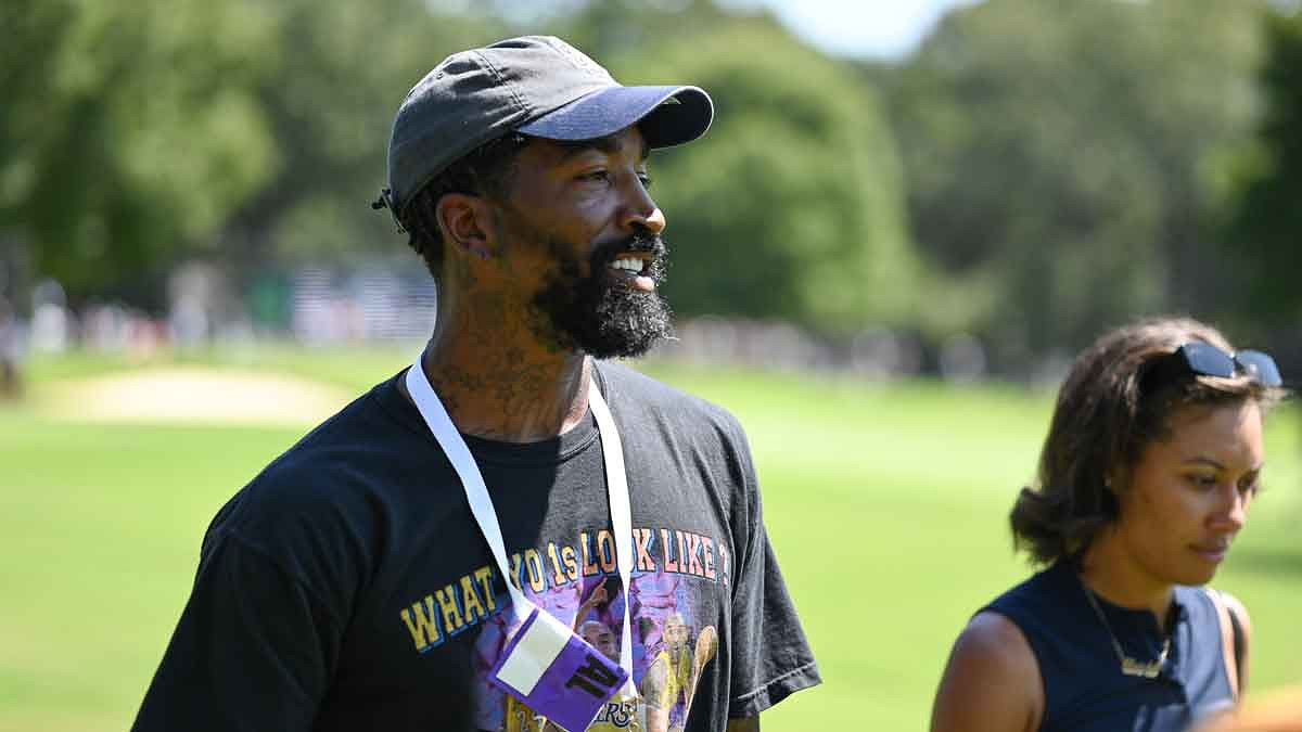 Former NBA player JR Smith looks on from the 3rd hole during the third round of the Tour Championship golf tournament.