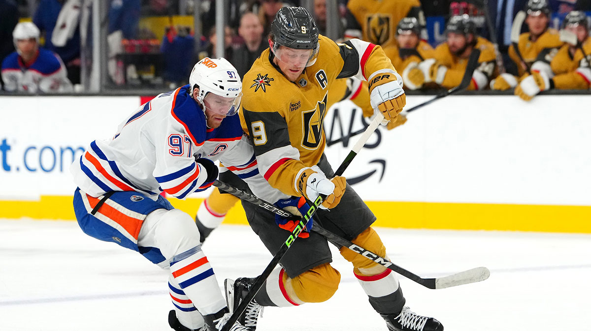 Edmonton Oilers center Connor McDavid (97) defends against Vegas Golden Knights center Jack Eichel (9) during the second period at T-Mobile Arena.