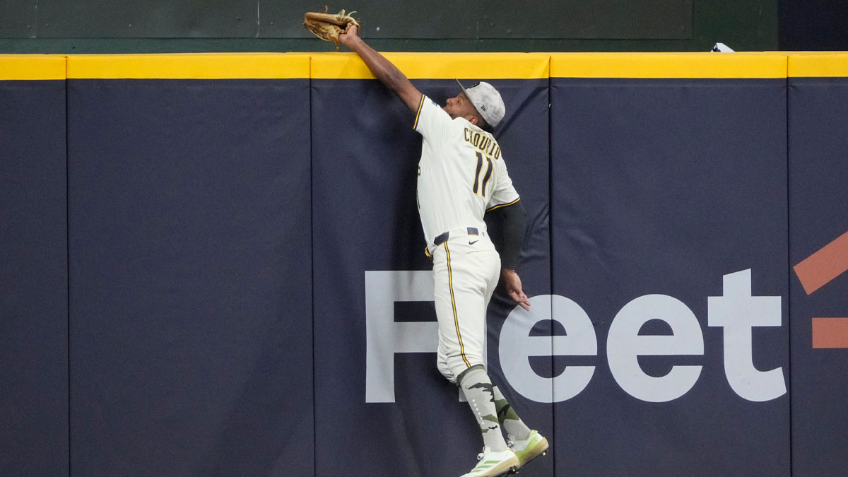 Milwaukee Brewers outfielder Jackson Chourio (11) keeps a home run from going over the wall against the Minnesota Twins in the eighth inning at American Family Field.